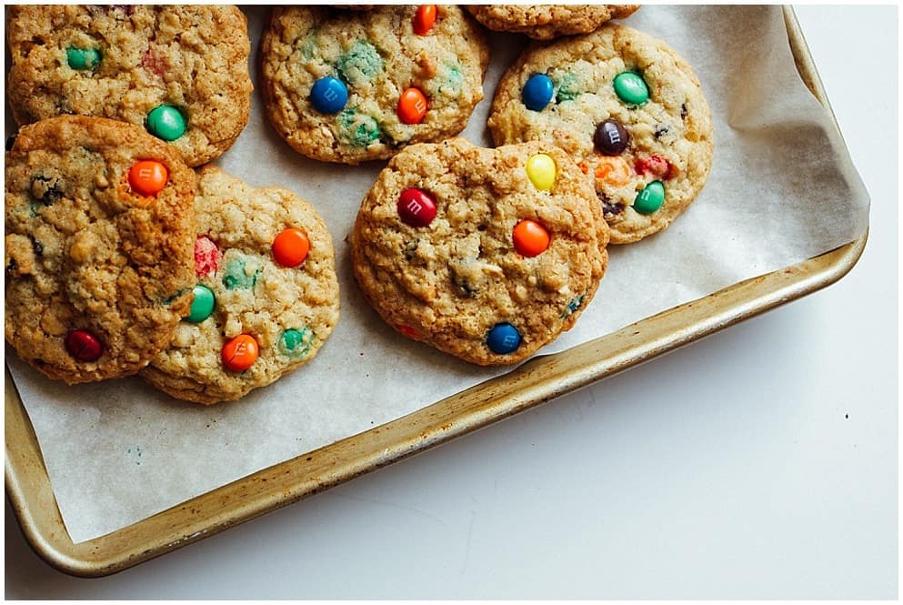 Trail Mix Cookies recipe by The Wood and Spoon Blog by Kate Wood. Fun cookies to make with kids! These trail mix cookies have raisins, chocolate candies (m&M's), peanuts and oats! The cookies have crisp edges and chewy centers and are simple and easy to make. Requires short time and one bowl to make. Trail mix cookies are good summer camp recipe, school recipe, craft idea to bake with kids. Find the recipe on thewoodandspoon.com