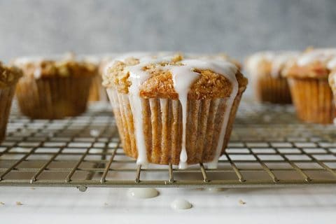 Hummingbird Muffins Recipe by thewoodandspoon.com . Crumb / streusel topped muffins based on the classic Southern hummingbird cake recipe, these muffins are filled with brown butter, banana, pineapple, brown sugar, and nuts. Topped with a simple glaze/ drizzle. This recipe would be perfect for an Easter breakfast or brunch and are a great treat to share with friends. Simple, easy recipe based on Bake From Scratch Coffee Cake. By The Wood and Spoon Blog.