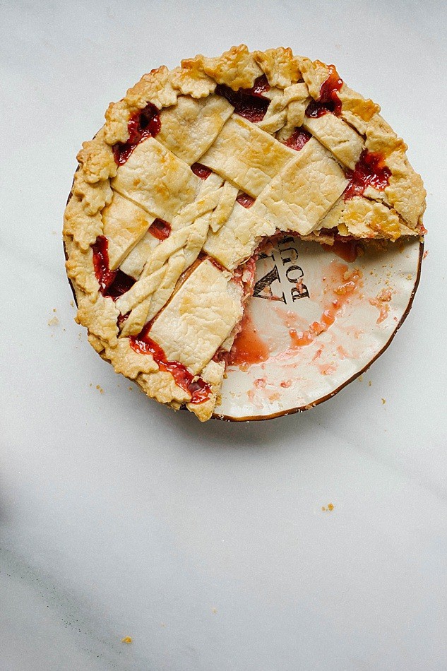 Strawberry Rhubarb Pie Recipe by The Wood and Spoon Blog. Tart rhubarb, sweet berries and a touch of cinnamon make this the perfect pie. Post includes information on how to use and trim rhubarb, tips on preparing the perfect flaky butter pie crust, and other spring pie inspiration. Can be made with a decorative or lattice pie top. thewoodandspoon.com