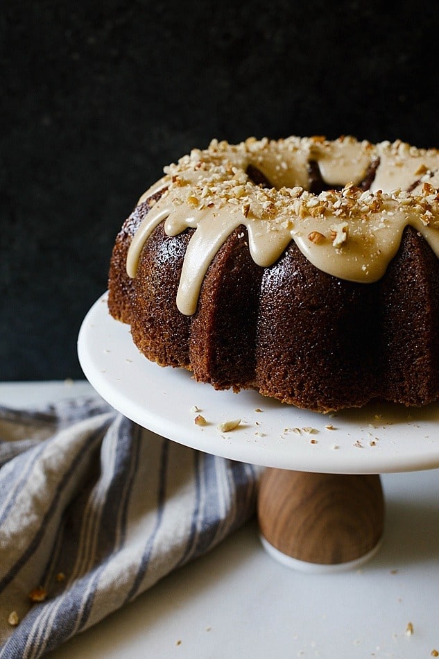 Carrot Bundt Cake with Brown Butter Glaze by The Wood and Spoon Blog. This moist cinnamon and carrot flavored cake is topped with a browned butter frosting and toasted chopped pecans. This recipe is one bowl, easy, and can be modified to make a layer cake as well. Perfect for parties and upcoming Easter brunch, breakfast, or dessert. thewoodandspoon.com