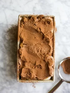 No-Churn Tiramisu Ice Cream by Wood and Spoon blog. This is a simple and delicious homemade ice cream for coffee lovers! Made with mascarpone cheese, espresso, and ladyfinger cookies this creamy frozen treat can be made without an ice cream machine! This is the perfect ice cream for coffee drinkers and tastes excellent as an affogato too! Find the recipe and how to at thewoodandspoon.com