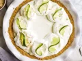 Creamy Key Lime Pie by Wood and spoon blog. This is a simple key lime pie that doesn't require the stovetop. Cream cheese, condensed milk, and key lime juice make this simple pie with a sweet and salty graham cracker crust. This is a great make ahead dessert that can be prepped in less than 30 minutes. Find this summery recipe on thewoodandspoon.com