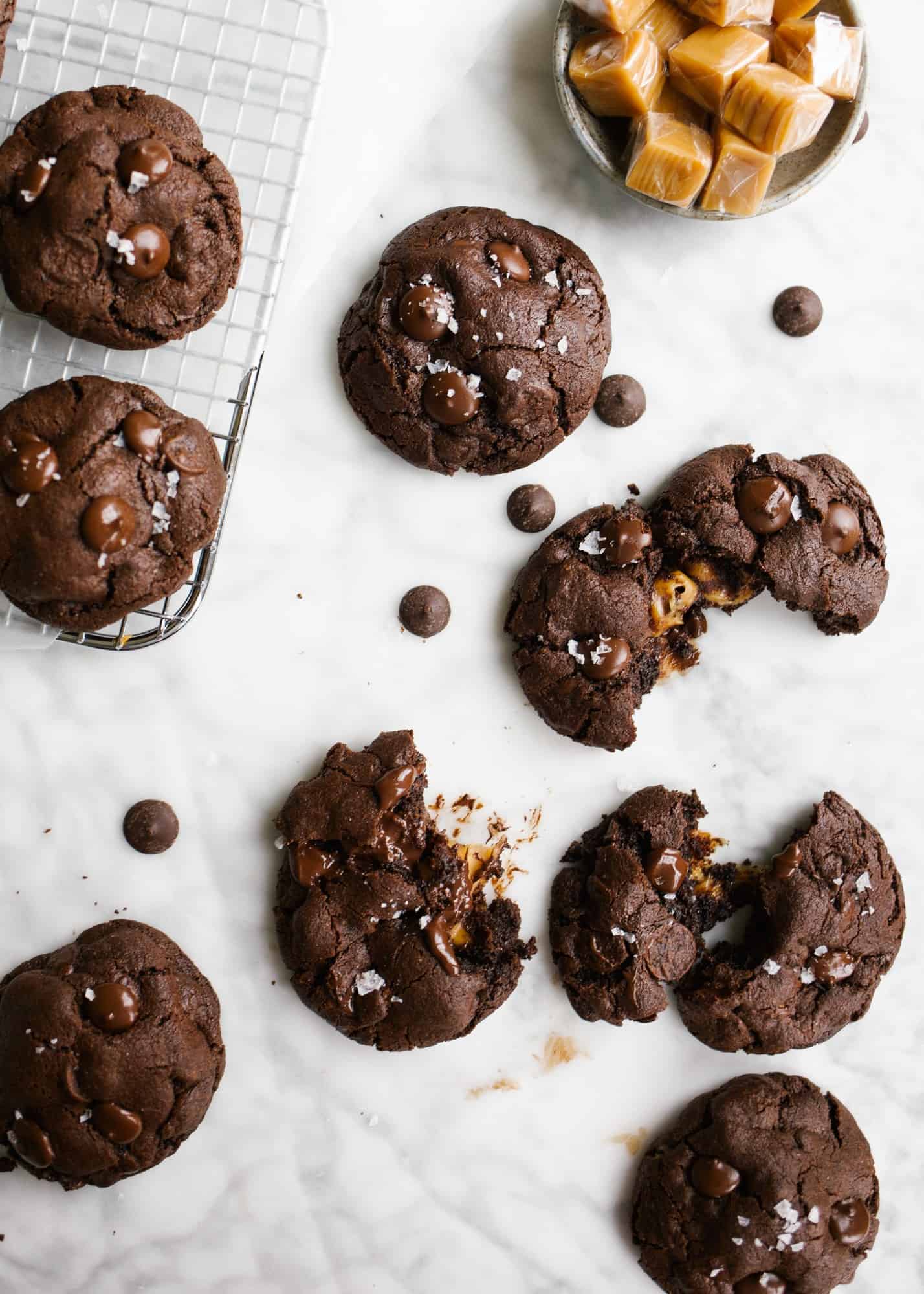 Chocolate Caramel Cookies by Wood and Spoon Blog. These are cocoa scented cookies stuffed with caramel chocolate candies so that each bite of cookie oozes with rich decadent insides. This recipe freezes well and serves a crowd. Find this double chocolate cookie recipe and how simple they are to make on thewoodandspoon.com