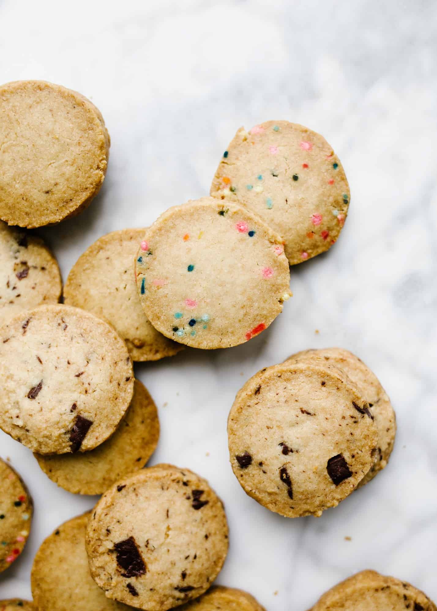 Shortbread Cookies by Wood and Spoon blog. These are simple all-butter shortbread cookies made quickly with tons of adaptions. Chocolate! Coffee! Lemon! Funfetti! Lavender! White Chocolate! Peppermint! The possibilities for these shortbread cookies are endless. Learn how easy it is to make your own adaptable shortbread cookies on thewoodandspoon.com