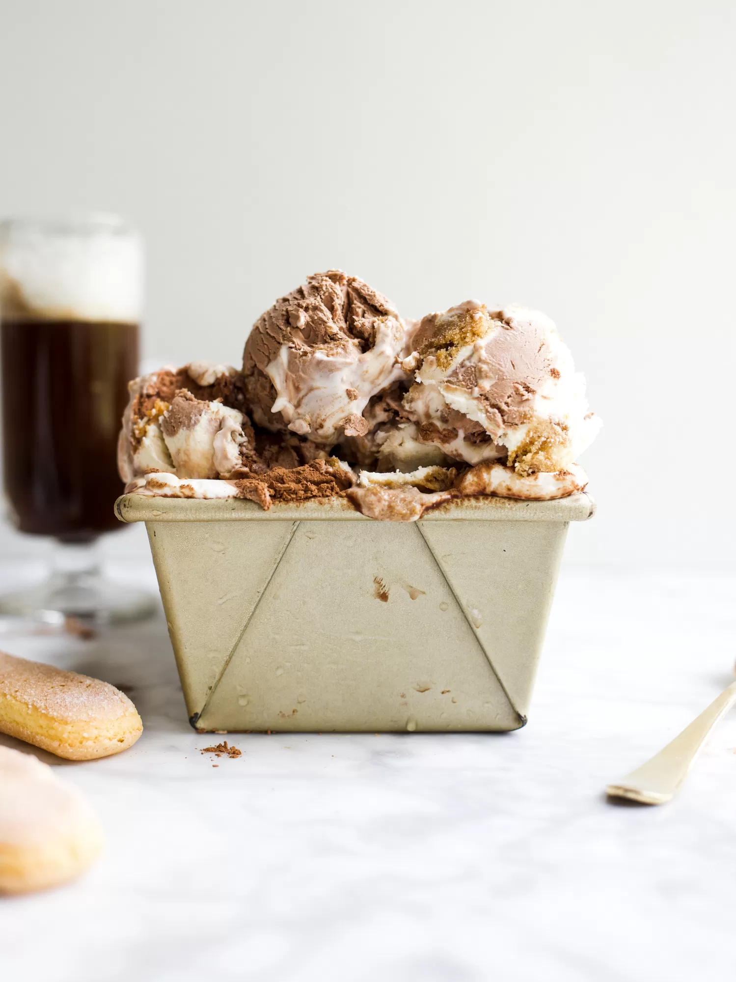 No-Churn Tiramisu Ice Cream by Wood and Spoon blog. This is a simple and delicious homemade ice cream for coffee lovers! Made with mascarpone cheese, espresso, and ladyfinger cookies this creamy frozen treat can be made without an ice cream machine! This is the perfect ice cream for coffee drinkers and tastes excellent as an affogato too! Find the recipe and how to at thewoodandspoon.com