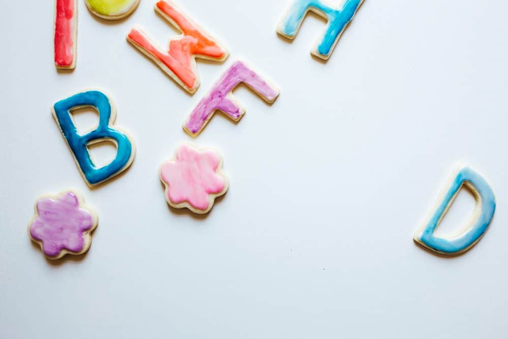 Painted Sugar Cookies Recipe and Tutorial by The Wood and Spoon Blog By Kate Wood. This is a recipe for almond vanilla sugar cutout cookies that doesn't require chilling the dough. The dough holds its shape for cookie cutters. The frosting isn't like a royal icing- it is a simple glaze made with milk and powdered sugar and flavoring. you can pipe or dip the cookies icing on and then paint with food coloring gel and alcohol. Find the how to on the blog thewoodandspoon.com