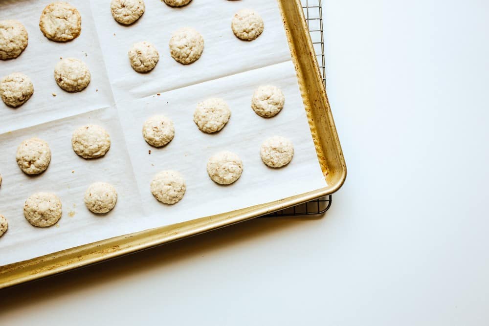 Crispy Butter Pecan Cookies Recipe by The wood and spoon blog by kate wood. These are tiny, mini buttery butter pecan cookies that require just a few minutes to make. These crisp cookies are almost like famous amos cookies and are inspired by Gmomma's cookies. Tiny chopped pecans, sugar, and flour are among the few ingredients here. Find the how to for these small cookies on thewoodandspoon.com