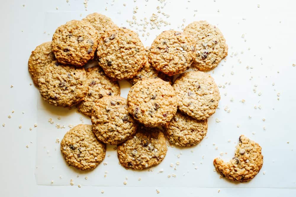 Loaded Oatmeal Cookies Recipe by The Wood and Spoon Blog by Kate Wood. These are simple stuffed oatmeal cookies loaded with your choice of ingredients. Chunky oats, chocolate chips. dried fruits like raisins and cranberries, or even candies, toffee, or nuts! These oatmeal cookies are simple to make, buttery, and full of brown sugar goodness. You can freeze as well! Find the recipe on thewoodandspoon.com