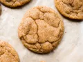 Pumpkin Snickerdoodles by Wood and Spoon blog. These are brown butter cookies scented with cinnamon, spice, and pumpkin puree! These fall cookies are perfect for pumpkin lovers and can be made ahead to feed a crowd. These are the best cookies for thanksgiving, fall, and more! Find the recipe on thewoodandspoon.com