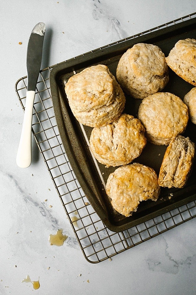 Maple Oatmeal Biscuits Recipe by The Wood and Spoon blog by Kate Wood. This is a simple, one bowl recipe for southern style fluffy layered biscuits filled with rolled oats and pure maple syrup. The biscuits are tall and thick, soft from the addition of buttermilk. Naturally sweet with maple syrup, these are best served for breakfast or as an easy addition to brunch. Find the recipe and the how to on thewoodandspoon.com