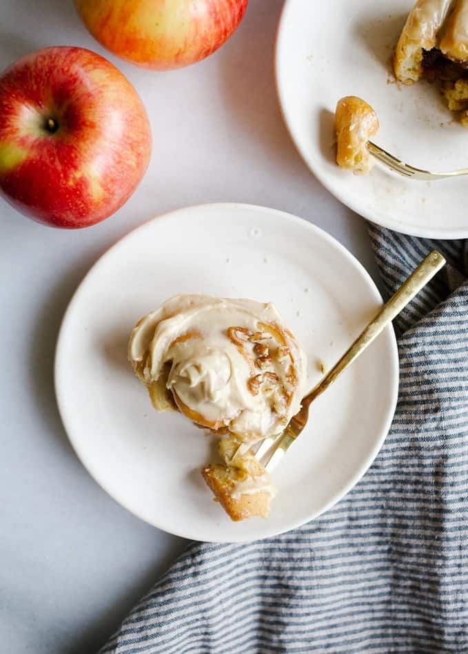 Apple Cinnamon Rolls by Wood and Spoon blog. These are simple morning rolls filled with brown sugar, cinnamon, and crisp Stemilt apples. On top, an Irish cream liquor cream cheese frosting gives the buns a sweetened and flavorful topping. Garnish with nuts! These pastries can be made overnight and baked fresh in the morning quickly and you can substitute in another fruit for apples! Find the st Patricks day breakfast treat on thewoodandspoon.com by Kate Wood