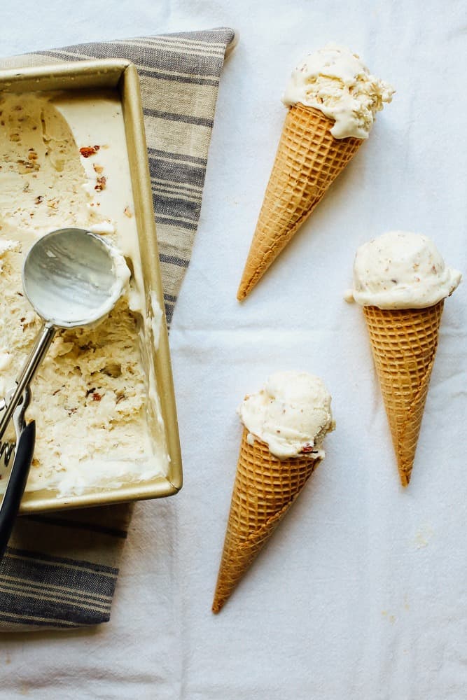 No Churn Honey Salted Almond Ice Cream Recipe By The Wood and Spoon Blog By Kate Wood. This is a no-churn recipe made with sweetened condensed milk, whipped cream, and clover honey. The nuts are cooked baked in butter and salt. Each bite of ice cream is sweet and salty, very creamy and almost naturally sweetened. Make the whole recipe in less than 30 minutes, very fast and easy. Recipe on thewoodandspoon.com