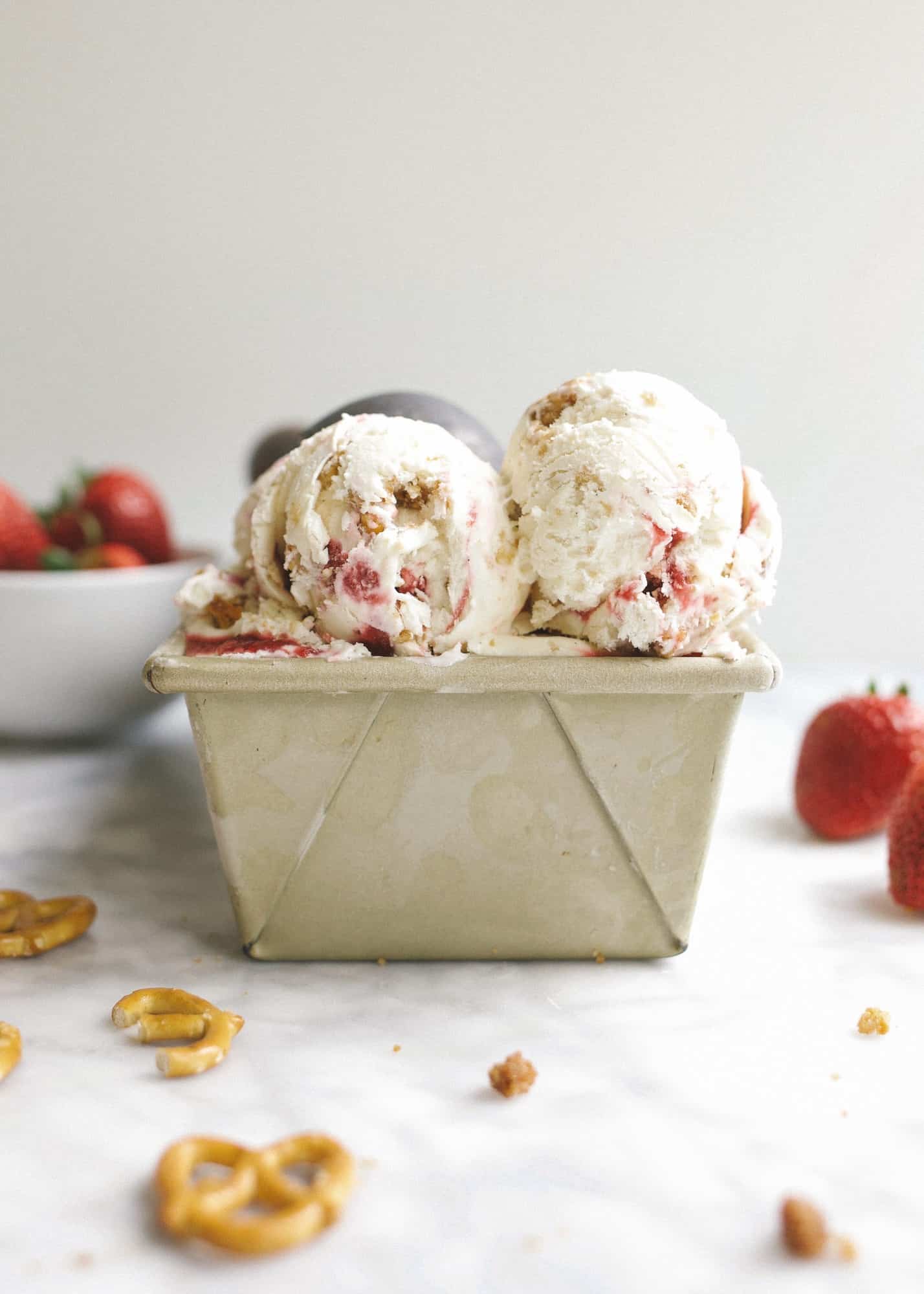 No-Churn Strawberry Pretzel Pie Ice Cream and A Father's Day Gift Guide! Learn how simple it is to make a no-churn ice cream that tastes like the classic strawberry pretzel pie casserole dessert! A cream cheese ice cream is swirled with a stovetop strawberry sauce and crumbled bits of pretzel crunch. The end result is a deliciously balanced and textured dessert that even non-ice cream lovers will love! Also, shop for all the dads in your life with this no-frills gift guide!