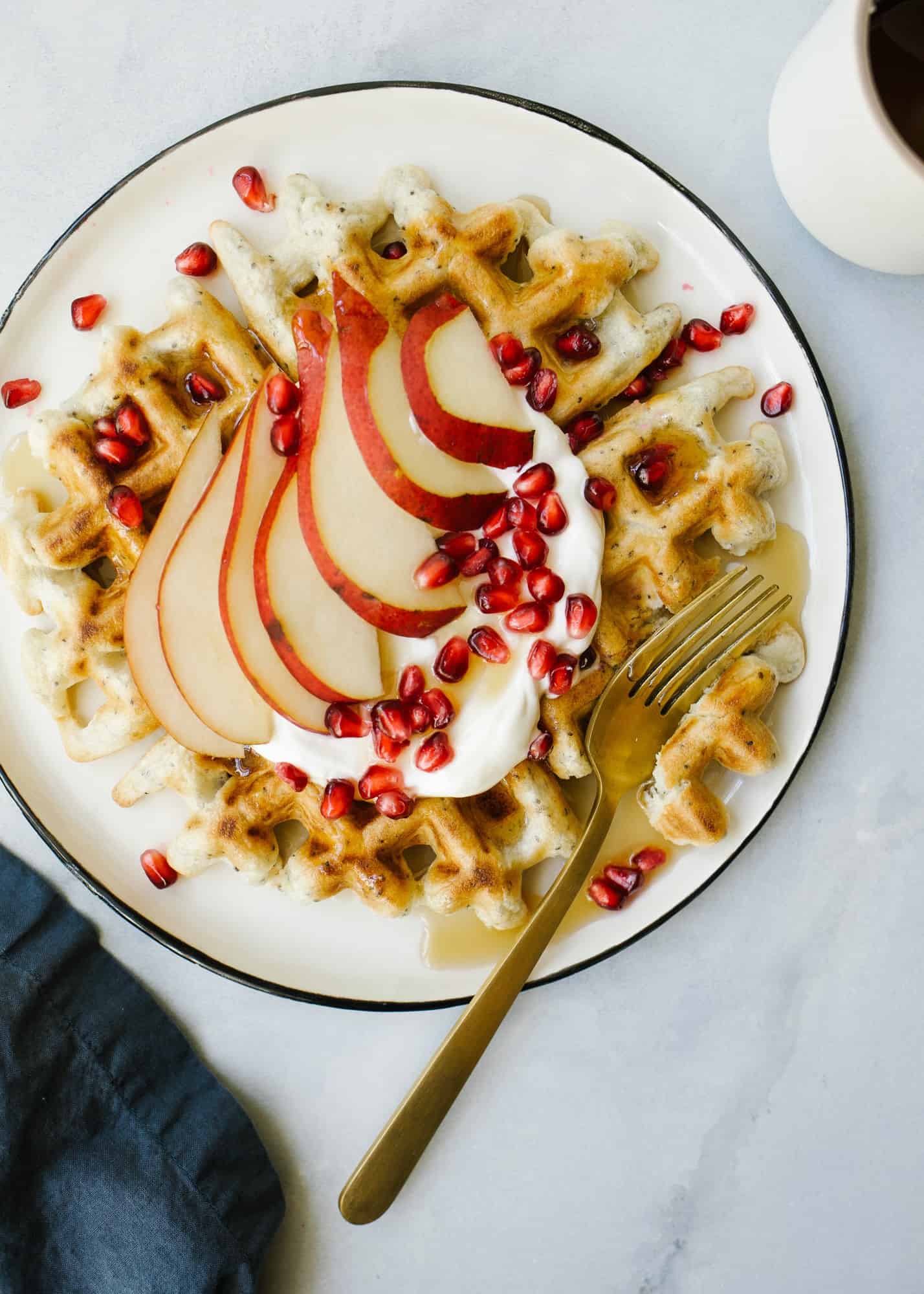 Family Waffle by Wood and Spoon blog. This recipe from Sarah Copeland book Everyday is Saturday is a healthy dairy free waffle made with quinoa and chia seed. This makes 4 thick Belgian style waffles and is best served with maple syrup or a healthy portion of fresh fruit and yogurt. Read more about these make ahead and reheat breakfast treats on thewoodandspoon.com