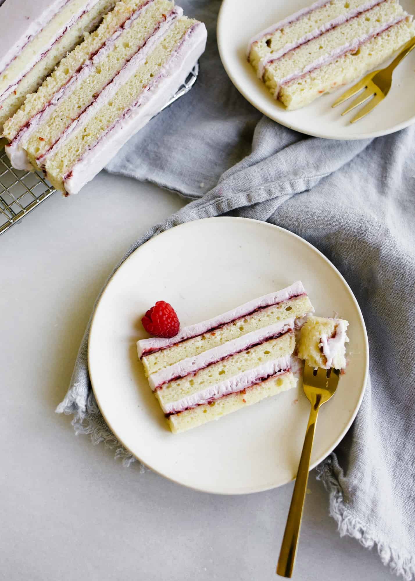 Lemon Lavender Icebox Cake by Wood and Spoon. This is a lemon layer cake frozen with lavender whipped cream and a raspberry preserve filling. The cake can be made ahead of time in advance and serves a crowd. Perfect springtime treat for easter dessert or mothers day. This cake can be made rectangle or square or round and is way more simple that is looks! Get the how to on infusing lavender into food and makes a soft and fluffy citrus cake. Recipe by Kate wood thewoodandspoon.com