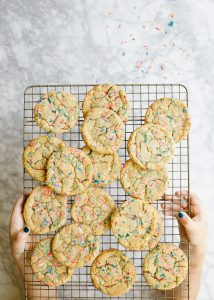 Funfetti Ice Cream Sandwiches by Wood and Spoon blog. These are soft and chewy sugar cookies loaded with sprinkles and box cake mix flavor. These nostalgic treats are stuffed with a no-churn ice birthday cake ice cream and make terrific summertime treats. Learn how simple these frozen desserts are on thewoodandspoon.com