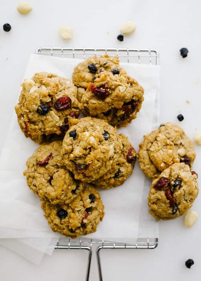 Vegan Oatmeal Cookies by Wood and Spoon. These are healthy vegetarian plant based cookies with coconut oil, flaxseed meal egg, dried fruit and nuts. Marcona almonds and dried cranberries and blueberries help to sweeten these brown sugar cookies and whole rolled oats keep them chewy. These stay soft for days and are flavored with cinnamon. Try this simple, one bowl healthy no butter less fat cookies for yourself and read more at thewoodandspoon.com