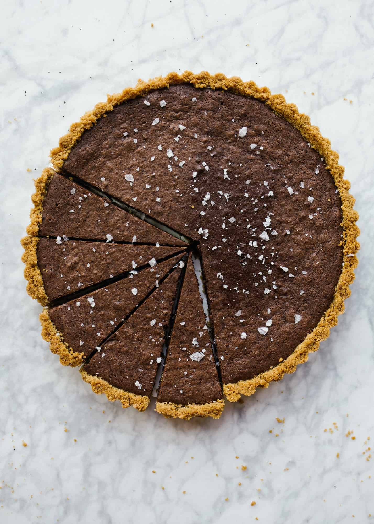 Fudgy Brownie Tart by Wood and Spoon by Kate Wood. This is a graham cracker press in butter crust with a melted chocolate and cocoa powder brownie milk tart. It's rich with the addition of Red Diamond Coffee and tastes best with a. sprinkle of flaky sea salt. Learn more about this simple holiday dessert recipe for a crowd on thewoodandspoon.com.