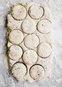 Funfetti Biscuits by Wood and Spoon blog. These are fluffy Southern Style buttermilk biscuits loaded with sprinkles, box mix cake flavor, and topped with a sweet and simple icing. There are tons of things to put sprinkles on and these sprinkle biscuits make for a fun and festive back to school breakfast. If you're looking for fun breakfast ideas for kids, look no. further than these sweet morning biscuits! The recipe and how to is on thewoodandspoon.com