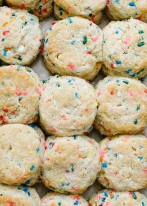 Funfetti Biscuits by Wood and Spoon blog. These are fluffy Southern Style buttermilk biscuits loaded with sprinkles, box mix cake flavor, and topped with a sweet and simple icing. There are tons of things to put sprinkles on and these sprinkle biscuits make for a fun and festive back to school breakfast. If you're looking for fun breakfast ideas for kids, look no. further than these sweet morning biscuits! The recipe and how to is on thewoodandspoon.com