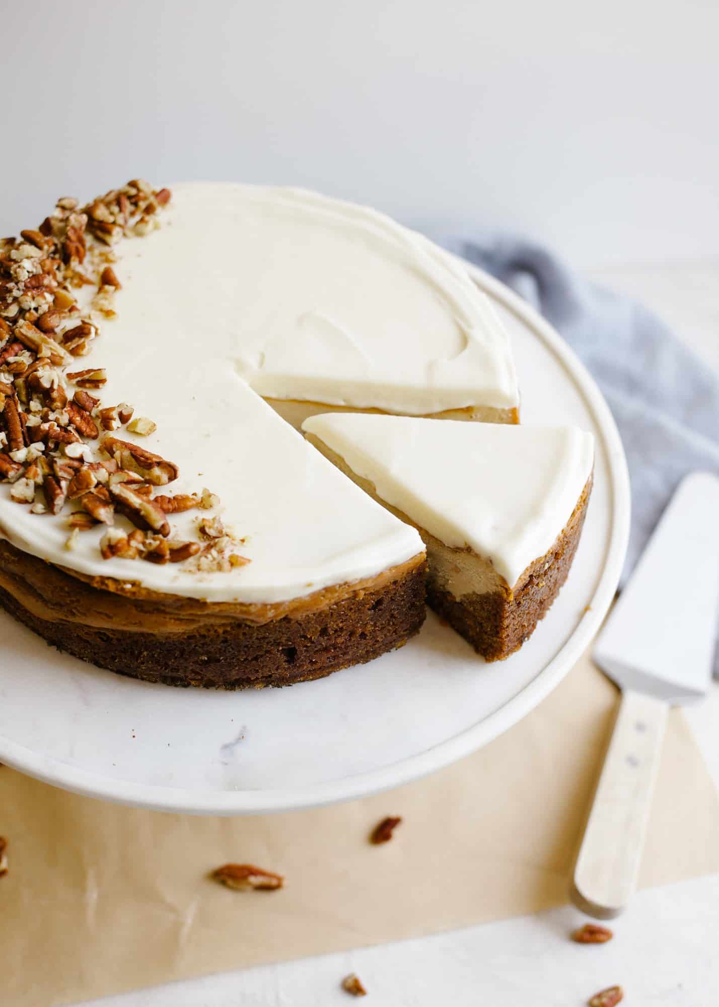 Carrot Cake Cheesecake by Wood and Spoon blog. This is a spring and easter inspired cake with a cinnamon spiced fluffy carrot cake bottom and brown sugar cheesecake top. A little frosting makes this cake inspired by Cheesecake Factory . Serve with chopped pecans and caramel sauce for an extra special dessert! Recipe and how to for marbled cheesecake on thewoodandspoon.com