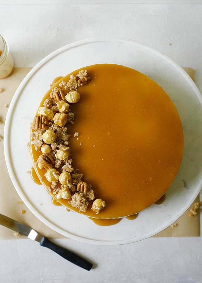 Brown Sugar Cheesecake with Oatmeal Cookie Crust and Butterscotch Sauce by The Wood and Spoon by Kate Wood. This is a creamy, almost caramel cheesecake made with brown sugar. The crust is a sweet and salty press-in crust made from oats. The whole thing is baked in a springform pan and topped with caramel corn and butterscotch sauce by Smitten Kitchen. Find the recipe and some tips on making a pretty cheesecake without cracks or soggy crust on thewoodandspoon.com