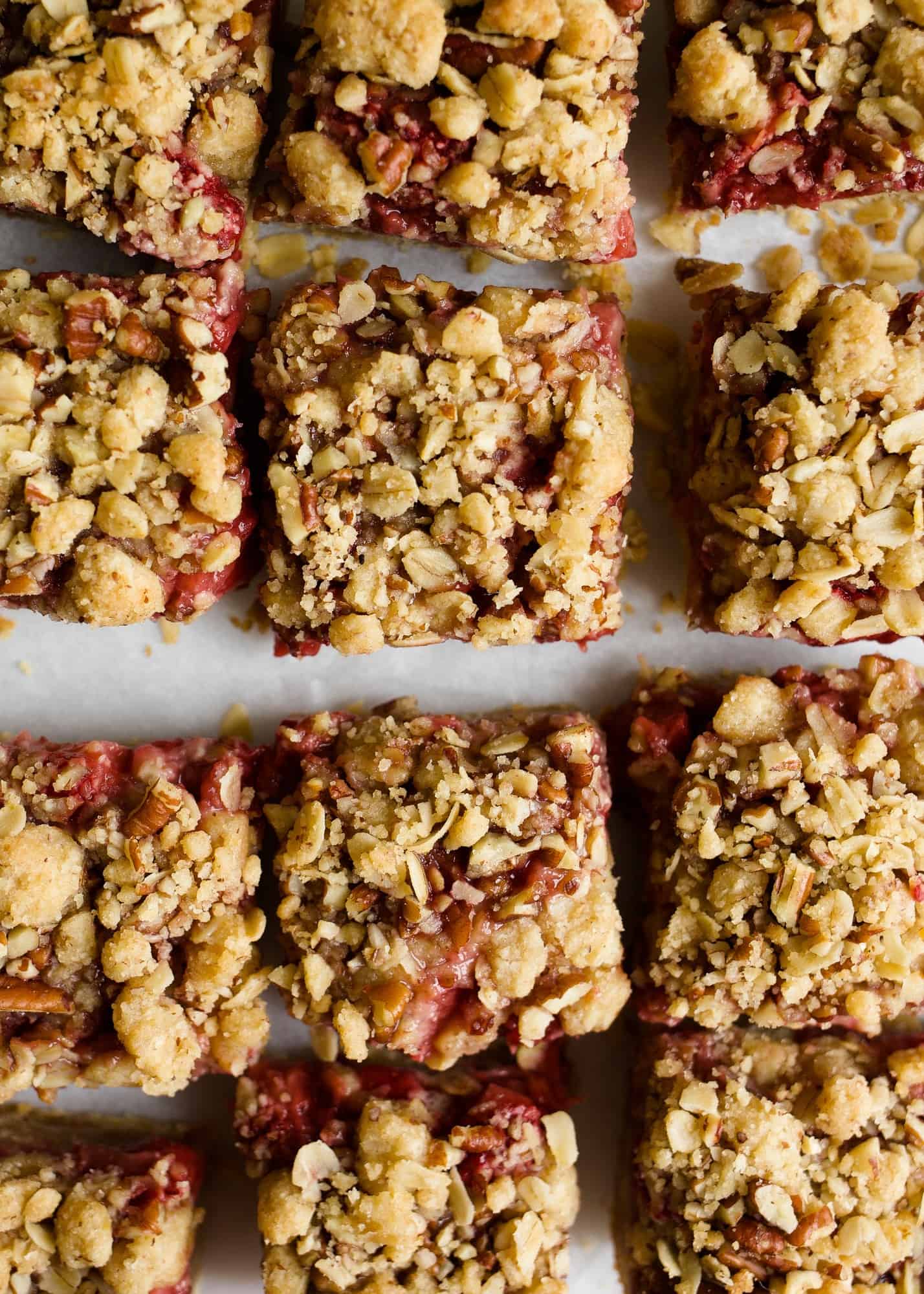 Strawberry Rhubarb Crumb Bars by Wood and Spoon blog are simple, make ahead jam filled bars made from spring fruit. The tart rhubarb makes a quick preserve with strawberries for a gooey centered oatmeal cookie bar. You can use fresh or frozen fruit for the jam and add additional fruit to make extra thick and fruity bars. Check out the recipe and how-to on thewoodandspoon.com