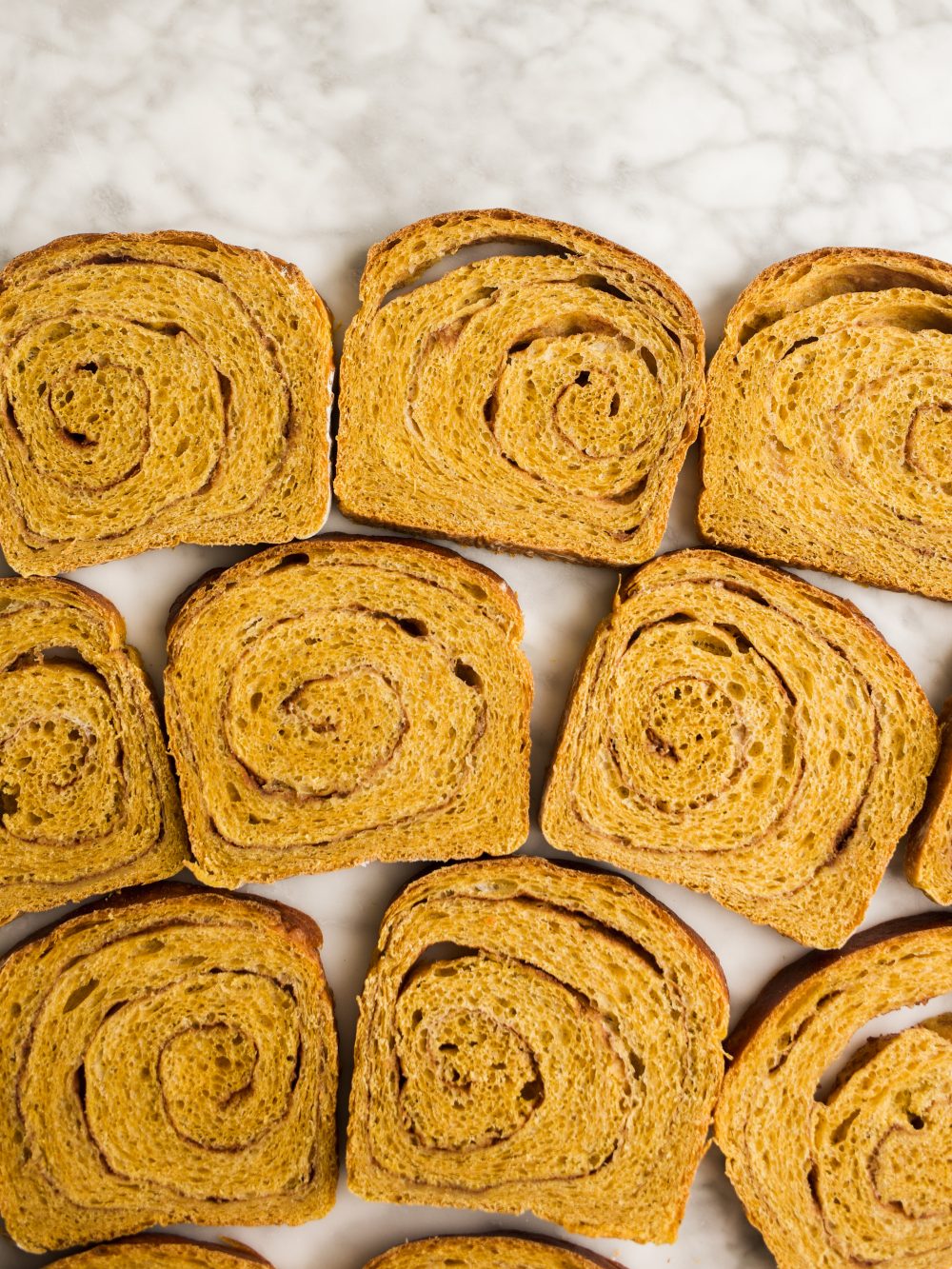 Pumpkin Swirl Bread by Wood and Spoon blog. This is a fluffy pumpkin yeast bread swirled with brown sugar and cinnamon and pumpkin pie spice. The bread is fragrant and works wonderfully for morning toast. Learn how to make a fall sandwich or yeast bread and how simple it is to add sugar to bread dough on thewoodandspoon.com