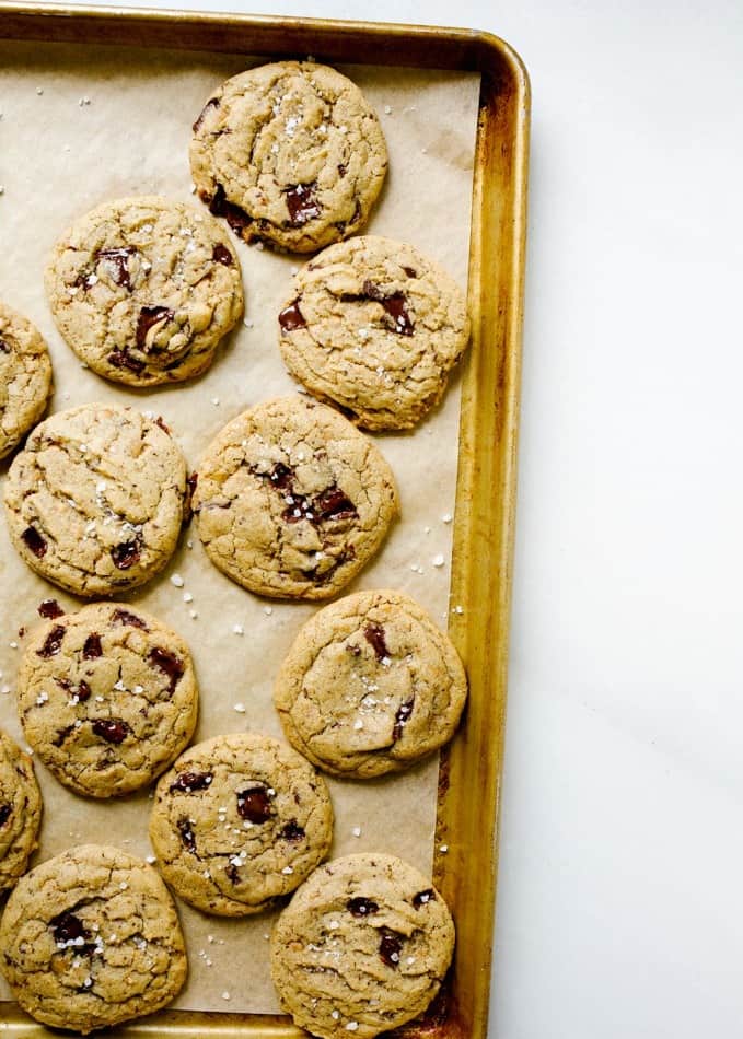 Toffee Espresso Chocolate Chip Cookies by Wood and Spoon blog. These dark chocolate chunk cookies are scented with coffee flavors and bits of toffee. Each bite is chewy with puddles of chocolate throughout. The toffee adds a bit of caramel sweetness to every bite. You can make this dough ahead, freeze it, or eat right away. Best served with a sprinkle of sea salt. Try this easy back to school cookie on thewoodandspoon.com by Kate wood