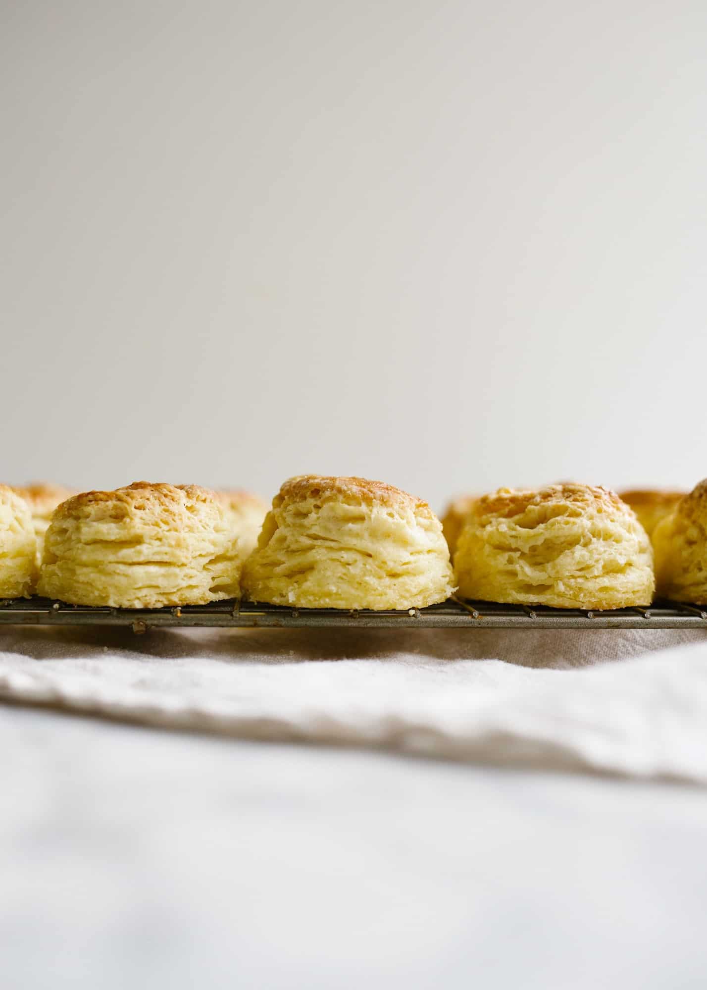 Mini Buttermilk Biscuits by Wood and Spoon blog. These are buttery bite sized laminated biscuits with flaky layers and loads of flavor. Learn how to make perfect Southern biscuits at home that taste even better than the store bought ones in the can. Also some things to do while social distancing and staying at home with coronavirus. Learn what moms and women can do at home now on thewoodandspoon.com