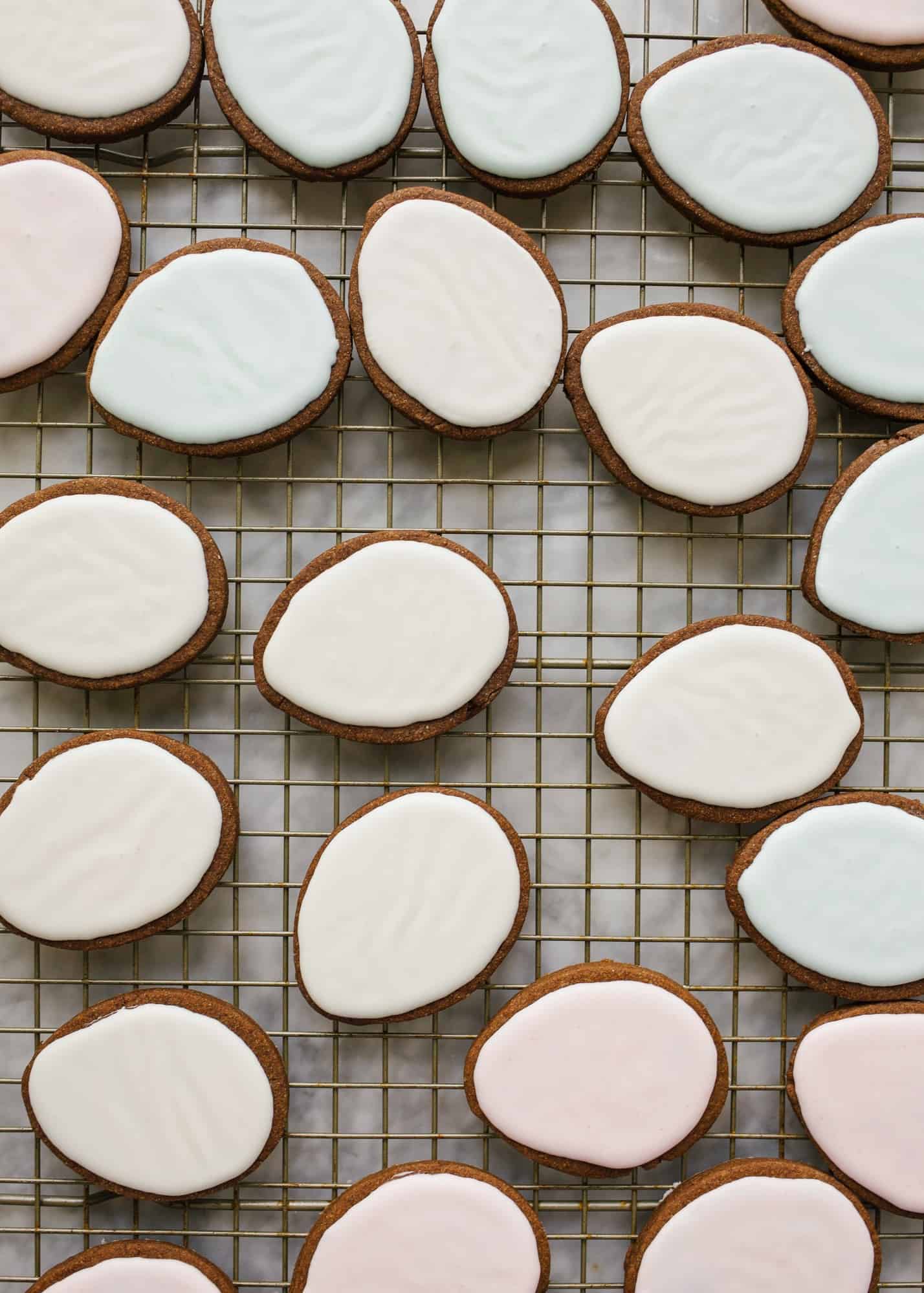 Chocolate Cutout Cookies (with Speckled Easter Egg Decorating Tutorial!) by Wood and spoon. These are cocoa powder and butter cutout cookies that are simple and don't require softened butter. You can make and freeze these in advance and the icing is simple. No royal icing- just a yummy one bowl glaze. This splattered robin egg decorating technique is a great edible easter craft for kids. Learn how to make these at home on thewoodandspoon.com