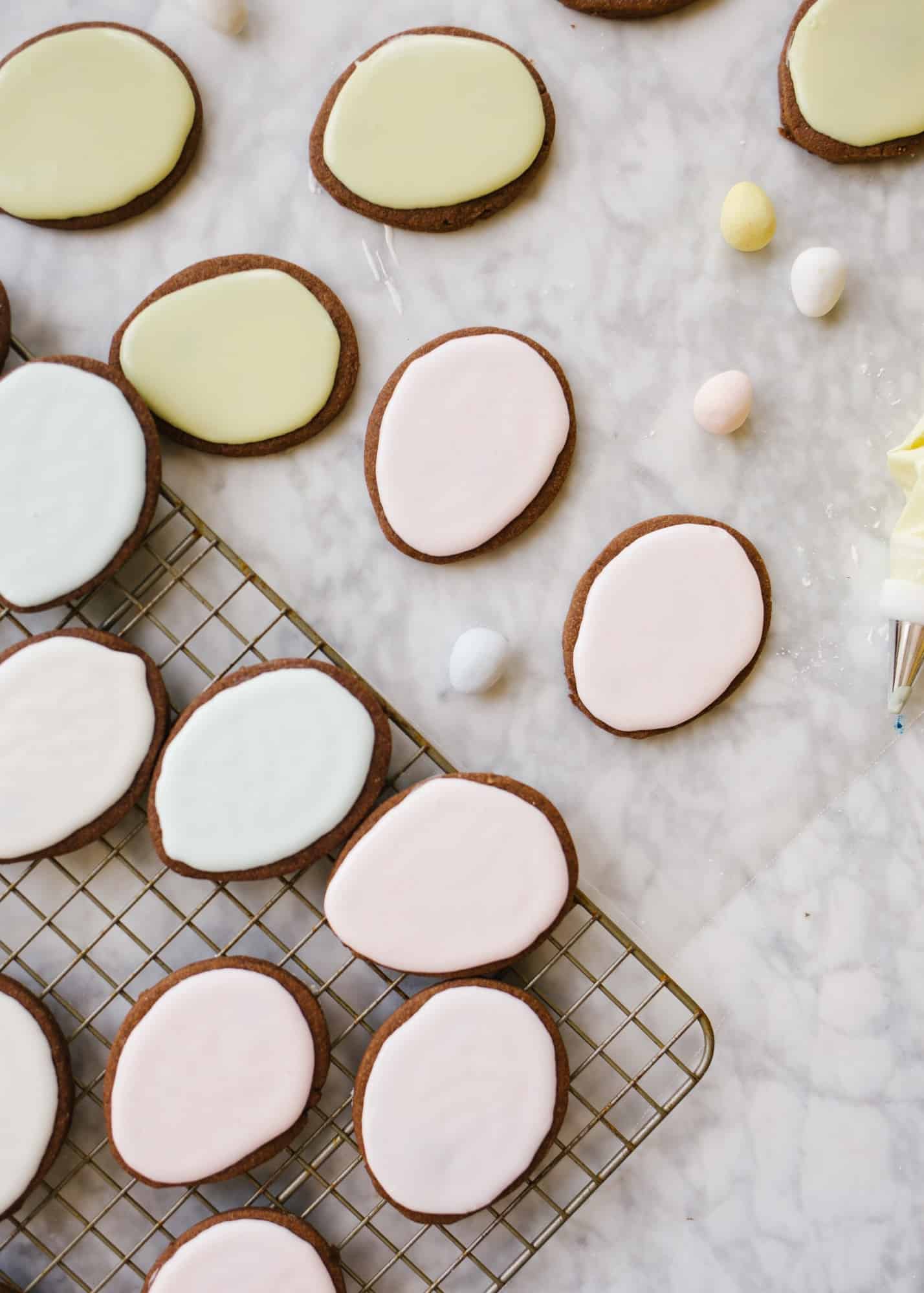 Chocolate Cutout Cookies (with Speckled Easter Egg Decorating Tutorial!) by Wood and spoon. These are cocoa powder and butter cutout cookies that are simple and don't require softened butter. You can make and freeze these in advance and the icing is simple. No royal icing- just a yummy one bowl glaze. This splattered robin egg decorating technique is a great edible easter craft for kids. Learn how to make these at home on thewoodandspoon.com