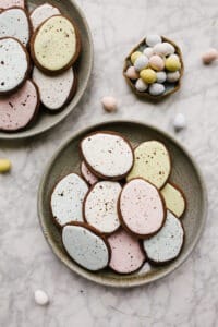 Chocolate Cutout Cookies (with Speckled Easter Egg Decorating Tutorial!) by Wood and spoon. These are cocoa powder and butter cutout cookies that are simple and don't require softened butter. You can make and freeze these in advance and the icing is simple. No royal icing- just a yummy one bowl glaze. This splattered robin egg decorating technique is a great edible easter craft for kids. Learn how to make these at home on thewoodandspoon.com