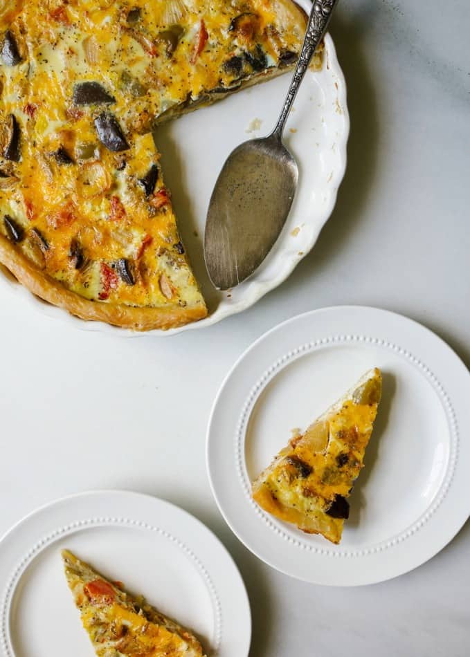 Roasted Summer Vegetable Quiche by Wood and Spoon blog. This is an all-butter pie crust filled with a cheesy quiche! Milk, parmesan, and cheddar are the dairy and fresh cooked vegetables and herbs are the filling. What to do with leftover vegetables and meat? Chop it and bake into this wonderful quiche! Sausage, chicken, bacon, or other vegetables would be a welcome addition for this dish that is great for breakfast, brunch, lunch or dinner. Find the recipe and how to on thewoodandspoon.com by Kate Wood. recipe