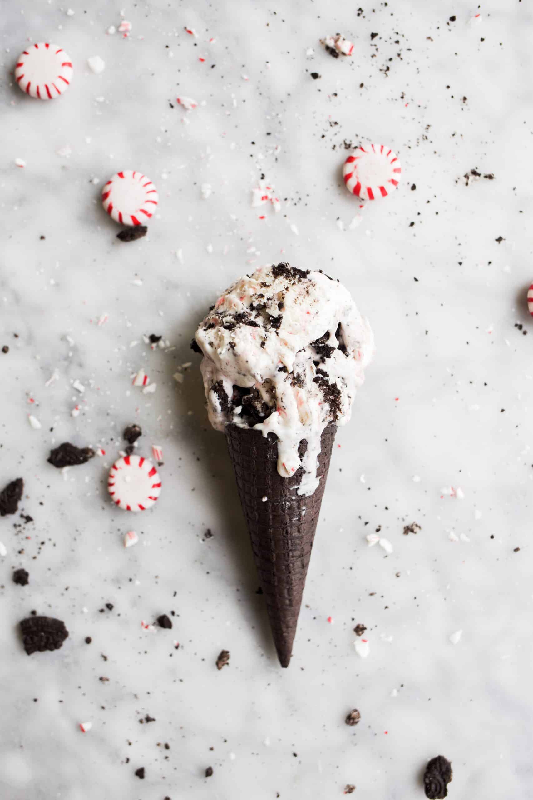 No-Churn Peppermint Cookie Ice Cream by Wood and Spoon blog. This is a recipe for no-churn vanilla ice cream loaded with crushed peppermint candy cane and Oreo cookies. The end result is a mint cookie ice cream that can be made in less than 5 minutes with no ice cream maker! This ice cream is perfect around the holidays and can be made easily. Find the recipe on thewoodandspoon.com!