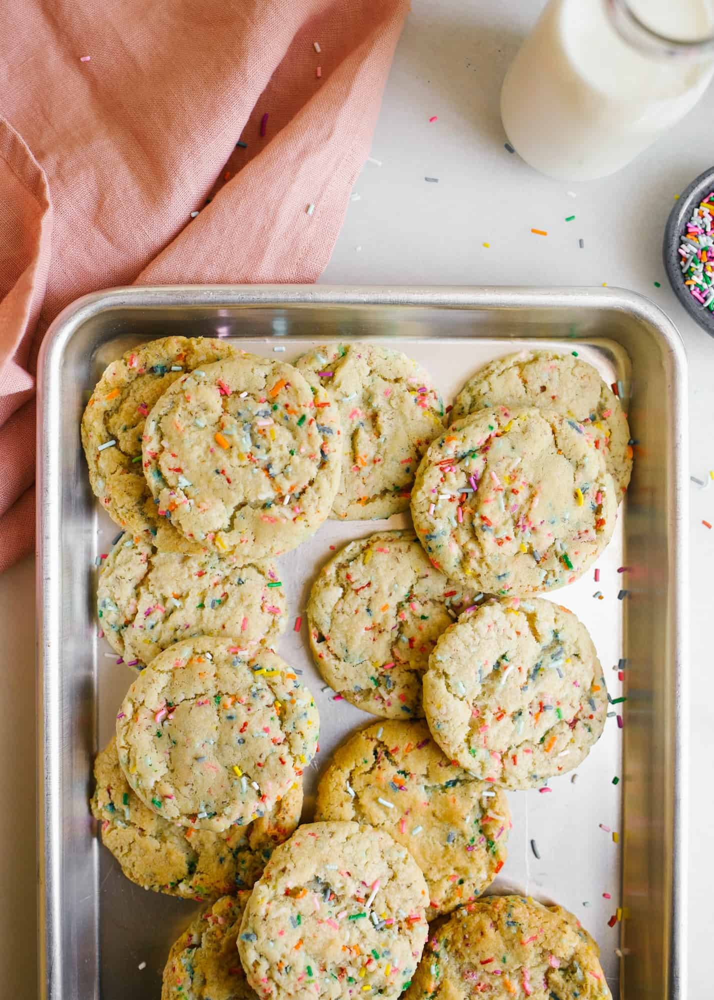 Vegan Funfetti Cookies by Wood and Spoon by Kate Wood. These are healthier sprinkle cookies made with coconut oil and organic sugar and flour. Clear vanilla extract gives the cookies their flavor. The cookies have crinkle tops and are loaded with colorful rainbow sprinkles. Learn how to make these at home on thewoodandspoon.com