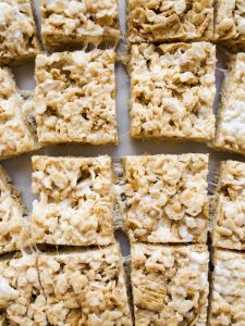 Sweet and Salty Crispy Rice Treats by Wood and Spoon blog. These are my favorite Rice Krispie treats from my book, Her Daily Bread, made with browned butter, golden graham cereal, and a pinch of salt. These make for a simple but decadent take on traditional Rice Krispie treats and are something everyone will love as dessert. These feed a crowd, are no-bake, and can be made in less than 10 minutes! Find out how easy these on are onthewoodandspoon.com .