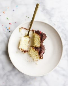 Mini Yellow Cake by Wood and Spoon blog. This tiny yellow cake is perfect for small celebrations, small batch bites, and smash cakes! Learn how simple it is to make a moist yellow cake from scratch with a fudge chocolate stovetop frosting on thewoodandspoon.com