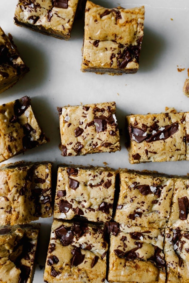 Brown Butter Muscovado Chocolate Chunk Cookie Bars Recipe by wood and Spoon blog. This is a recipe from displaced housewife new book. Chewy, sweet and salty blondies made with rich caramel tasting sugar and dark chocolate. Sea salt finishes these bars that make great dessert, tailgate and party snacks, or late night treats. Find the simple how-to on thewoodandspoon.com by Kate wood.