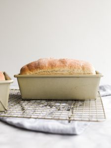 Mom's Homemade Bread by Wood and Spoon blog. This is a recipe excerpt from Her Daily Bread, a simple wheat loaf with added flaxseed meal, honey, and olive oil. Learn how simple homemade bread to make from scratch on thewoodandspoon.com