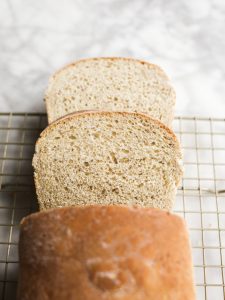 Mom's Homemade Bread by Wood and Spoon blog. This is a recipe excerpt from Her Daily Bread, a simple wheat loaf with added flaxseed meal, honey, and olive oil. Learn how simple homemade bread to make from scratch on thewoodandspoon.com