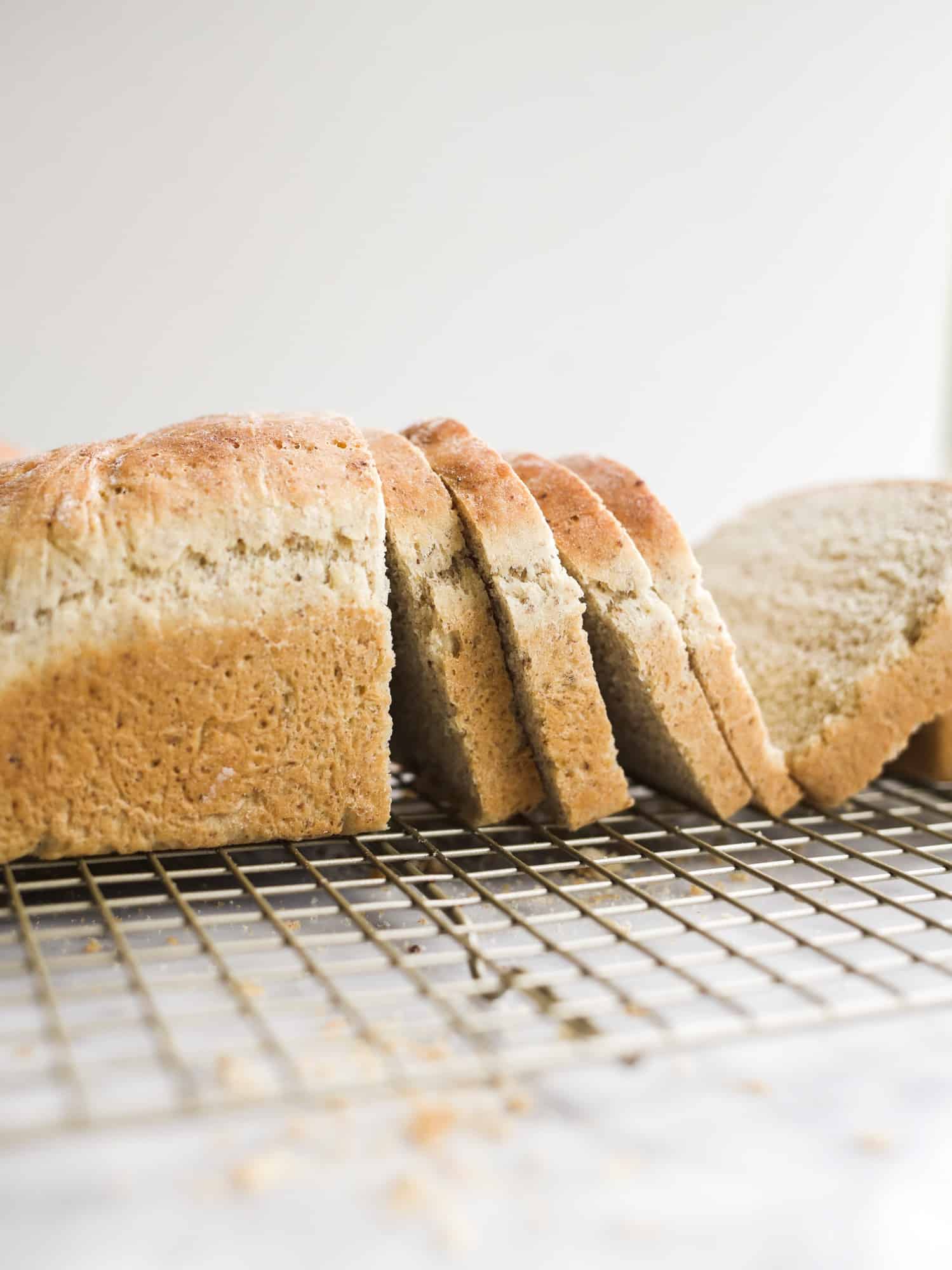 Mom's Homemade Bread by Wood and Spoon blog. This is a recipe excerpt from Her Daily Bread, a simple wheat loaf with added flaxseed meal, honey, and olive oil. Learn how simple homemade bread to make from scratch on thewoodandspoon.com