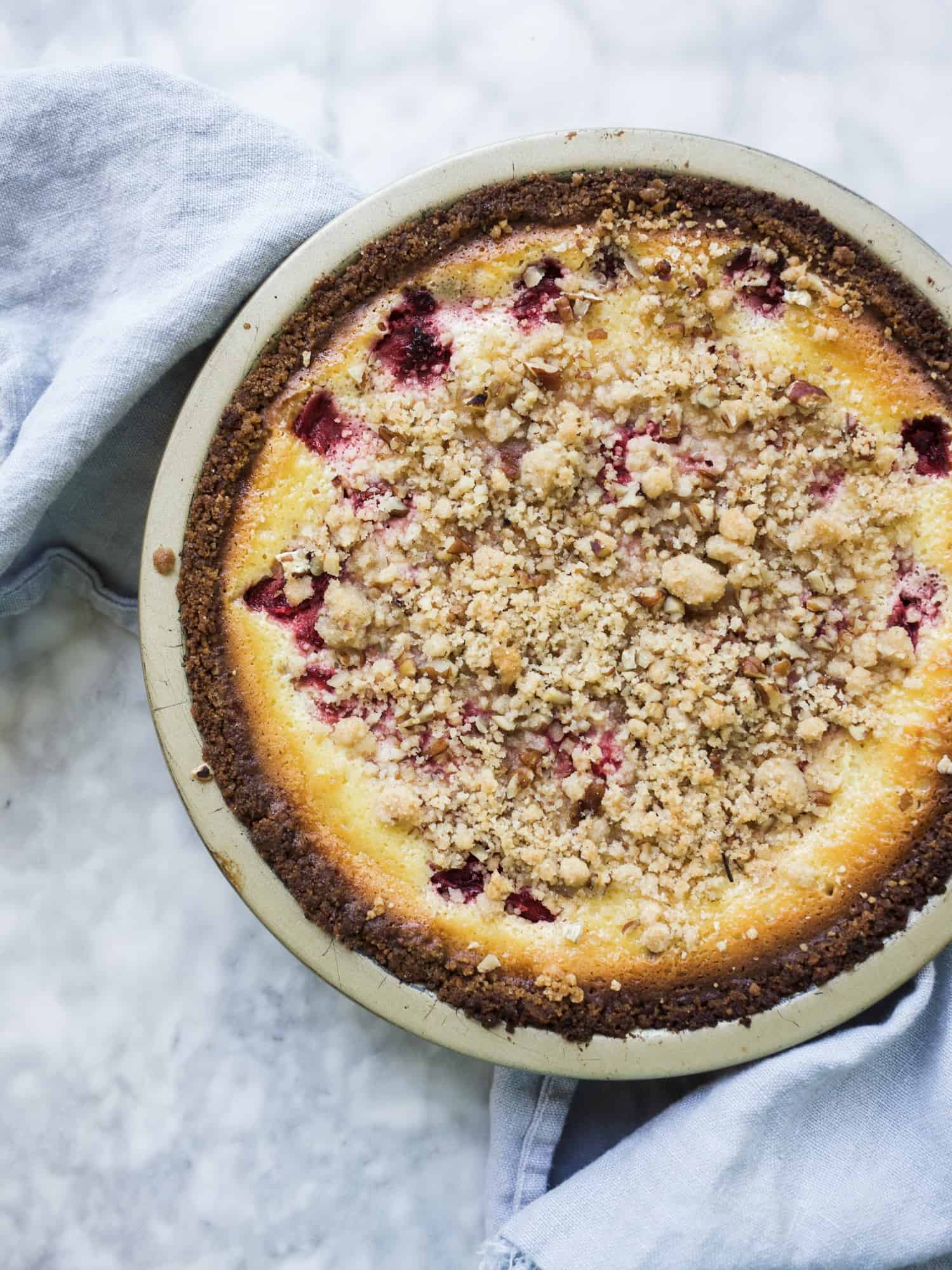 Strawberries and Cream Pie by Wood and Spoon. This a custard pie filled with strawberries. The filling is slightly tangy due to the addition of sour cream, and the crust has added texted and flavor thanks to pecans, salt, and graham cracker crumbs. This streusel berry pie is delicious and a great dessert to share in the summer months when fresh berry produce is available. Find the recipe on thewoodandspoon.com