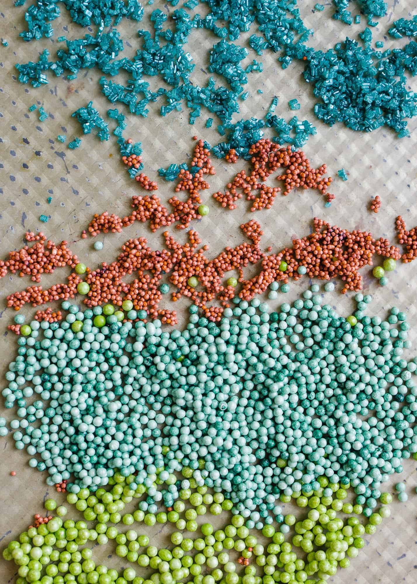 Homemade Sprinkles by Wood and Spoon blog. Here's the how to on making sprinkles from scratch! Follow one of three ways to make hand-dyed jimmies, nonpareils, and flaked sugar confetti. Use these edible decorations to glitter cakes, cookies, cupcakes and more! Find the recipes and learn DIY from scratch here on thewoodandspoon.com