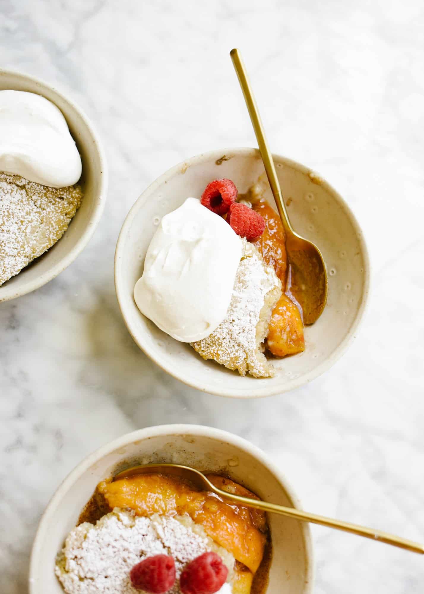 Skillet Fruit Pancake by Wood and Spoon. Similar to a breakfast cobbler, this morning treat features baked sugared fruit underneath a golden fluffy pancake. The dish serves a few and is best topped with whipped cream or a dusting of powdered sugar. Substitute in your favorite seasonal fresh or frozen fruit to enjoy! Find out more about the recipe on thewoodandspoon.com