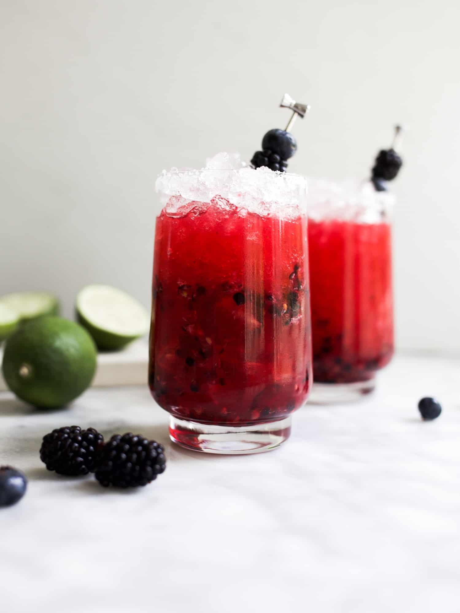 Black and Blue Margaritas by Wood and Spoon Blog. These are blackberry blueberry margaritas, the recipe which is from my new book Her Daily Bread. Get the how to on this refreshing summer marg on thewoodandspoon.com