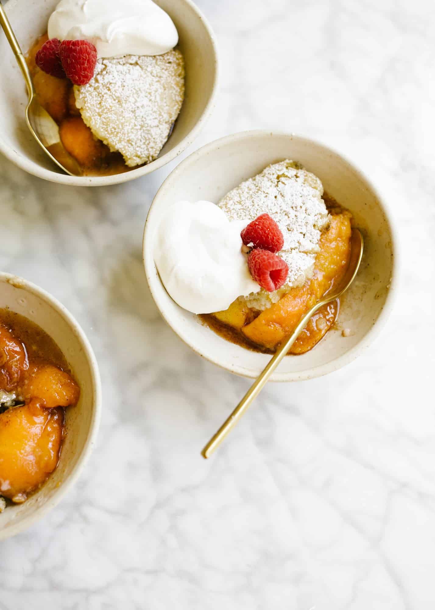 Skillet Fruit Pancake by Wood and Spoon. Similar to a breakfast cobbler, this morning treat features baked sugared fruit underneath a golden fluffy pancake. The dish serves a few and is best topped with whipped cream or a dusting of powdered sugar. Substitute in your favorite seasonal fresh or frozen fruit to enjoy! Find out more about the recipe on thewoodandspoon.com