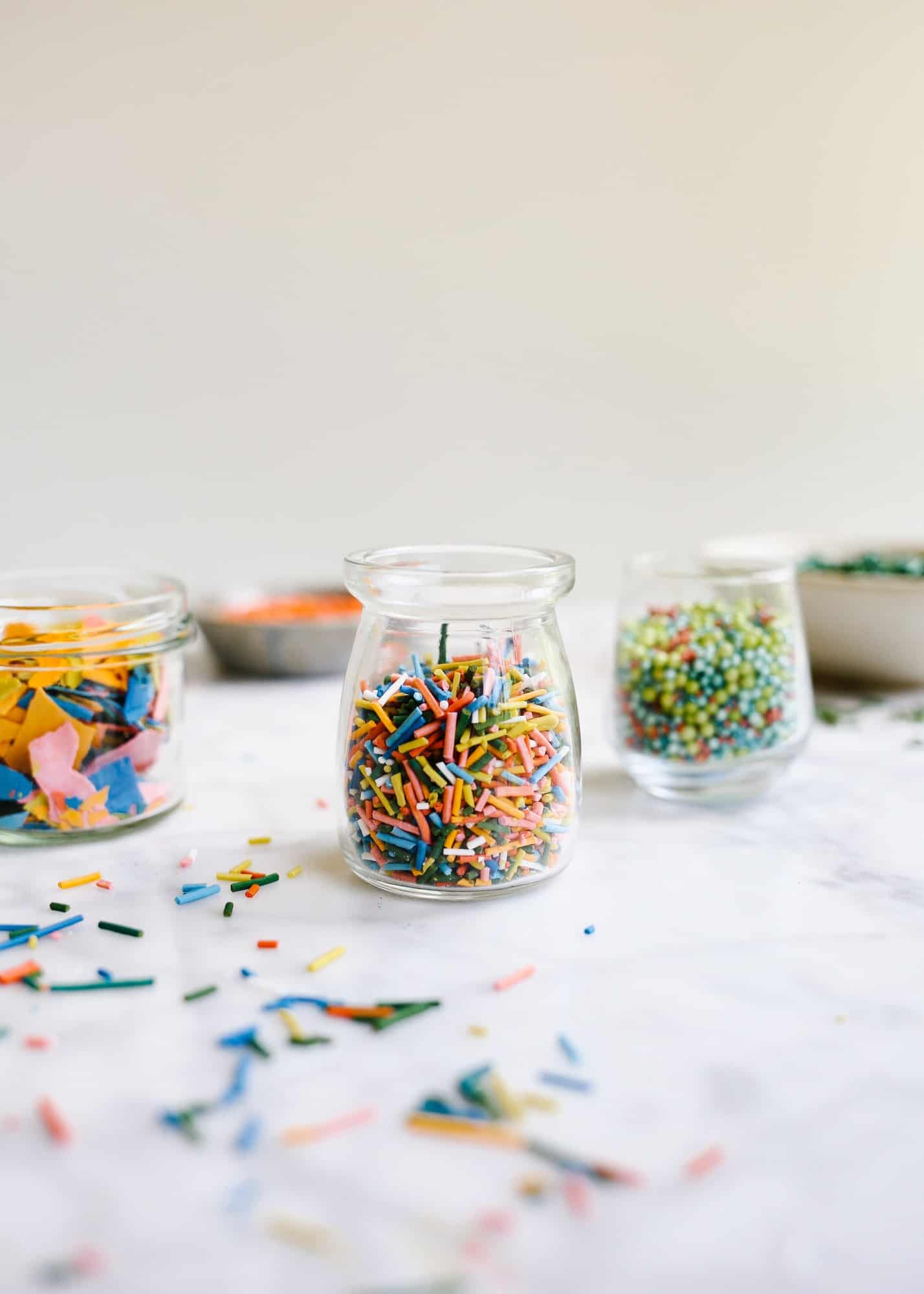 Homemade Sprinkles by Wood and Spoon blog. Here's the how to on making sprinkles from scratch! Follow one of three ways to make hand-dyed jimmies, nonpareils, and flaked sugar confetti. Use these edible decorations to glitter cakes, cookies, cupcakes and more! Find the recipes and learn DIY from scratch here on thewoodandspoon.com