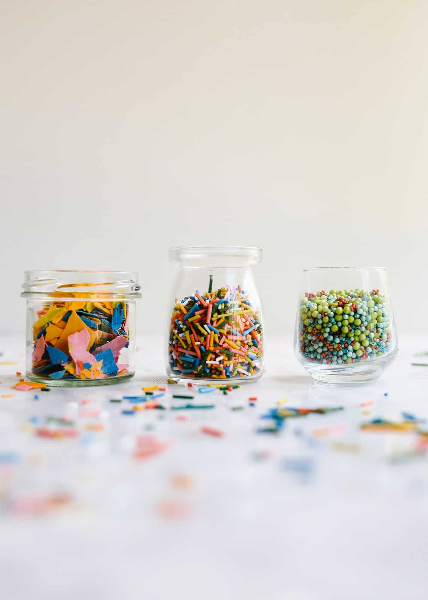 Homemade Sprinkles by Wood and Spoon blog. Here's the how to on making sprinkles from scratch! Follow one of three ways to make hand-dyed jimmies, nonpareils, and flaked sugar confetti. Use these edible decorations to glitter cakes, cookies, cupcakes and more! Find the recipes and learn DIY from scratch here on thewoodandspoon.com