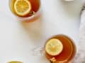 Sweet Tea Hot Toddy recipe by Wood and spoon blog. This is a bourbon, lemon, cinnamon and honey cocktail sweetened with pre made red diamond sweet tea. A southern take on the classic cocktail. Serve it warm for a refreshingly cozy holiday winter beverage. Make for a crowd for parties too! Read more at thewoodandspoon.com